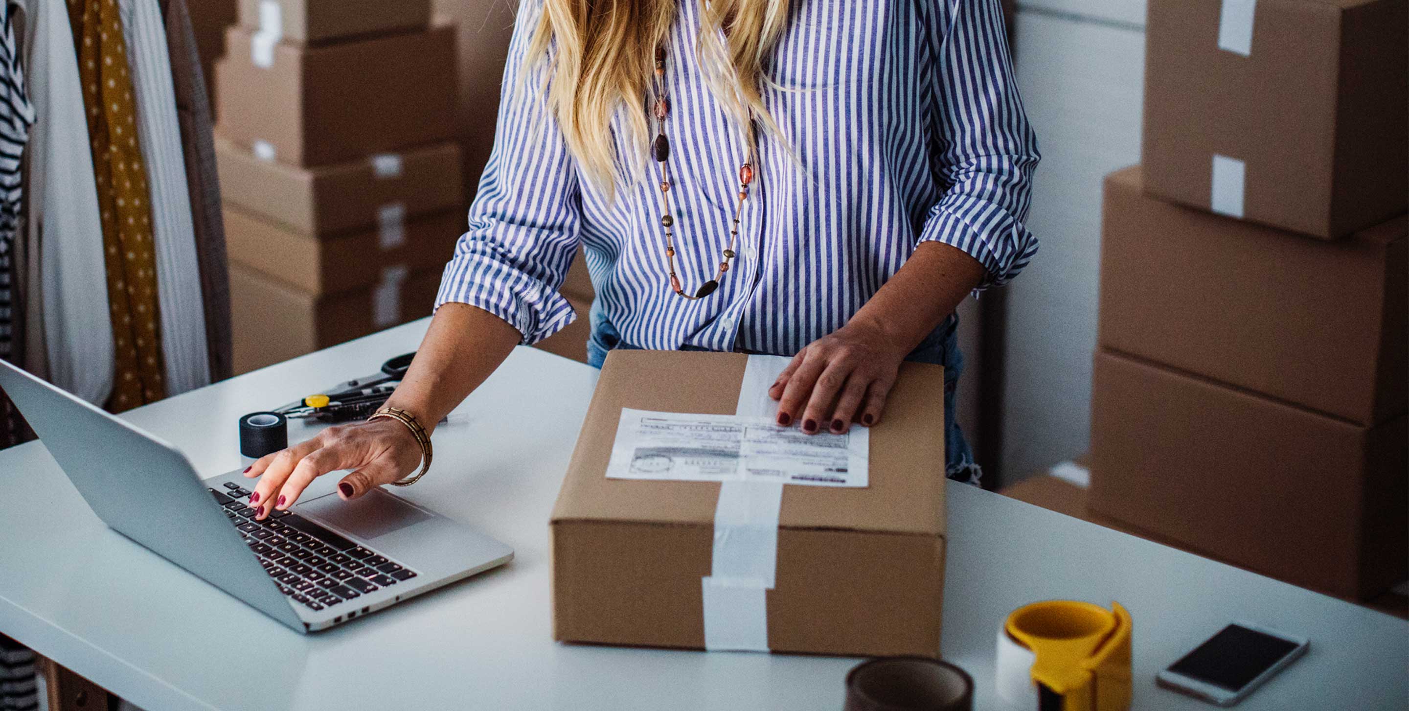 Person doing work on her computer for her retail business