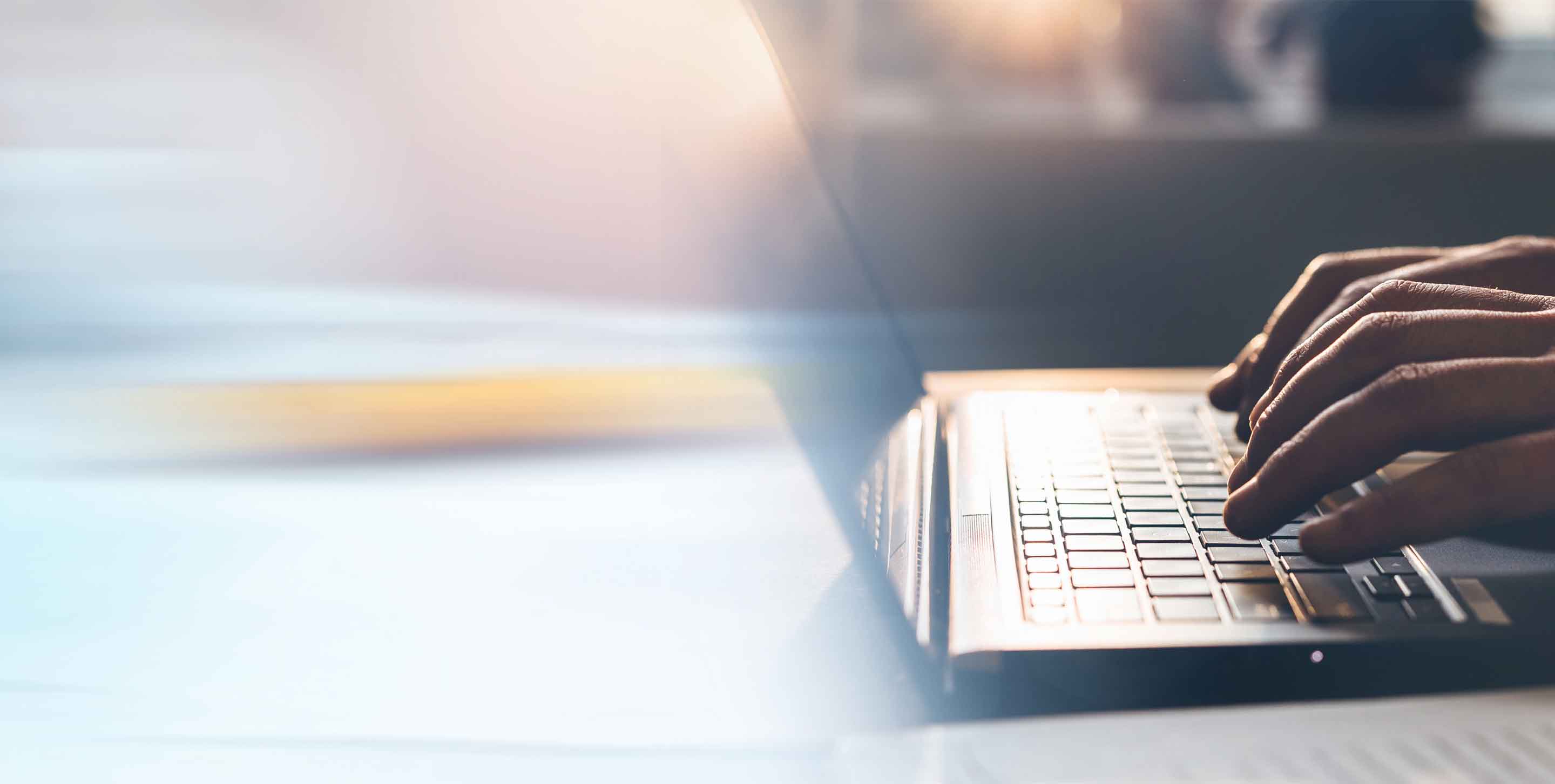 Businessman working on laptop. Panoramic business banner