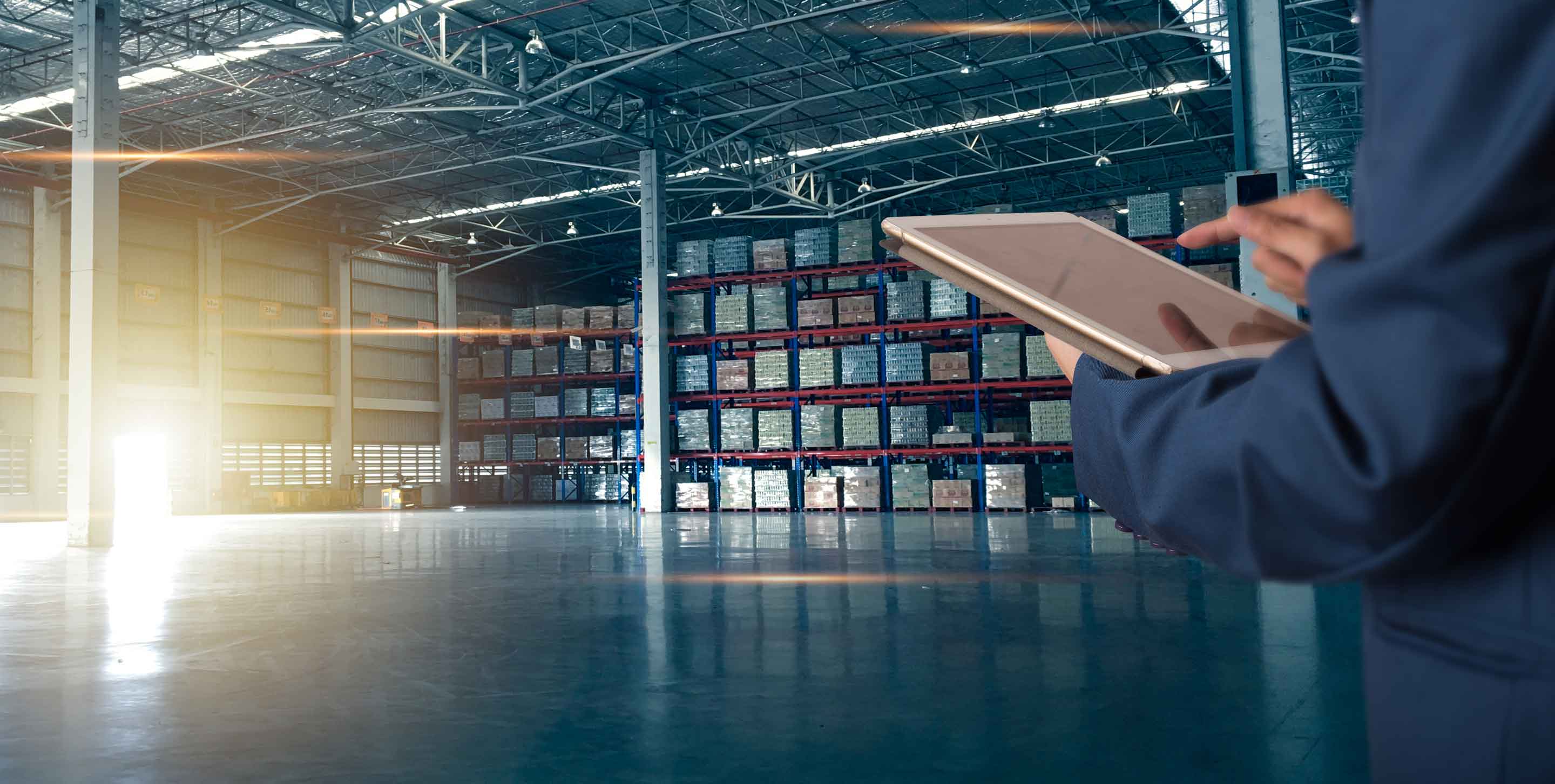 Businessman manager using tablet check and control for workers with Modern Trade warehouse logistics. Industry 5.0 concept