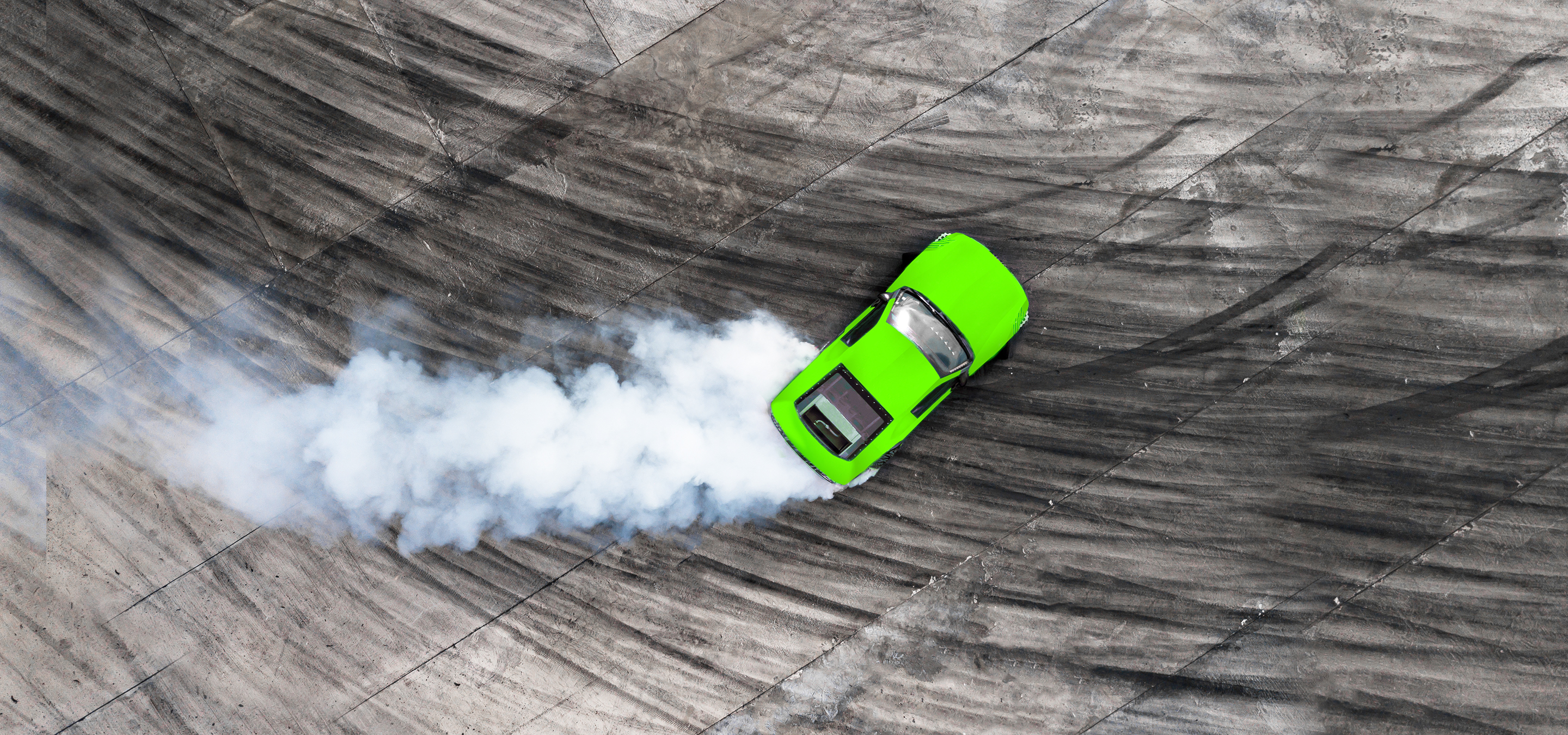 Aerial top view car drifting on asphalt race track with start and