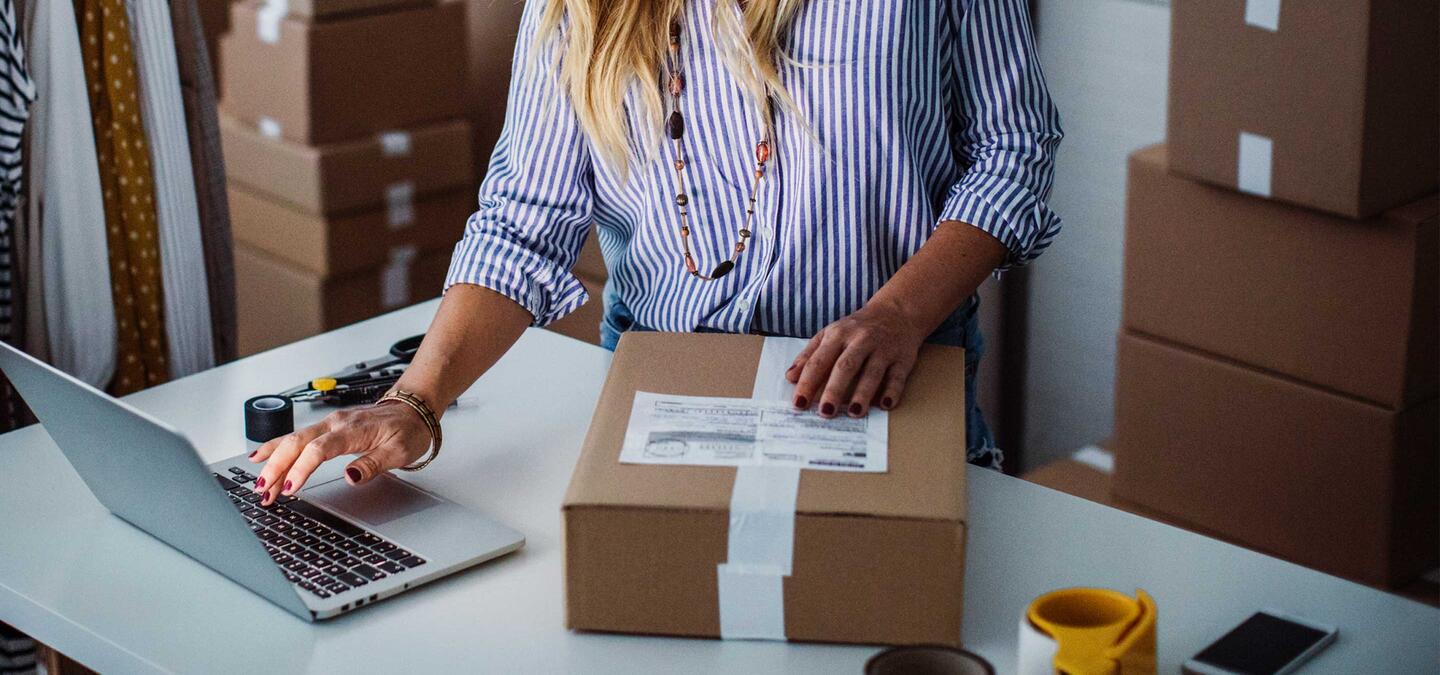 Person doing work on her computer for her retail business