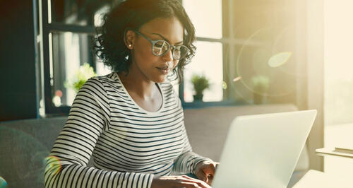 Woman typing on laptop