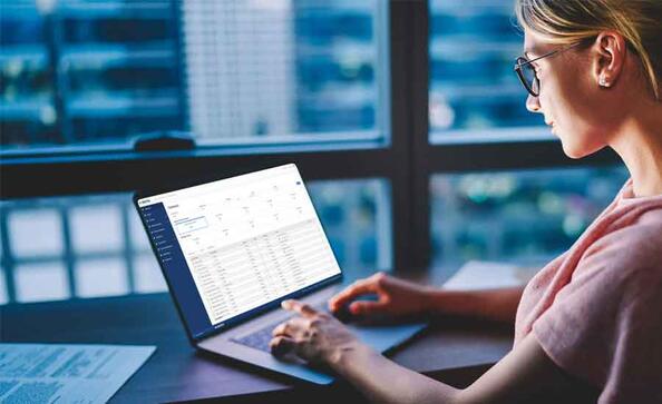 woman on a laptop using vertex tax software