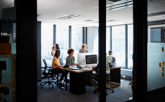 Creative business team actively collaborating in office space