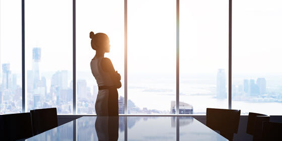 Woman Standing by Window